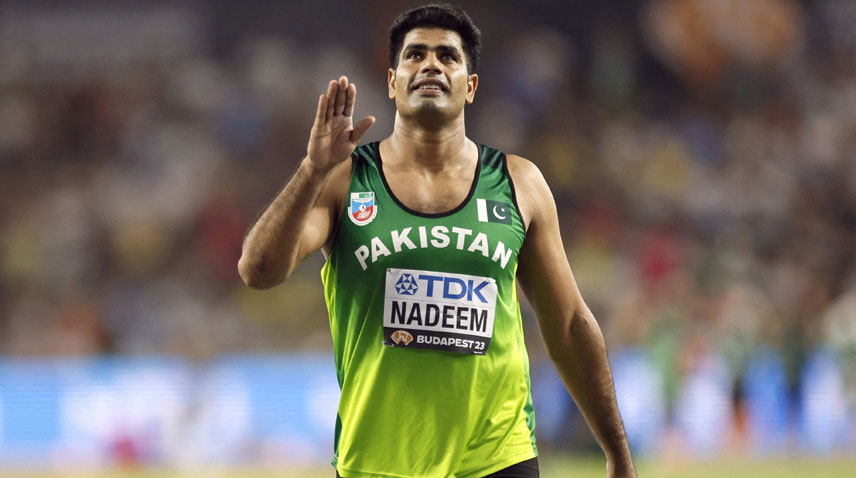 Javelin champion Arshad Nadeem waves his hand to the crowd after winning gold in the Paris Olympics 2024.