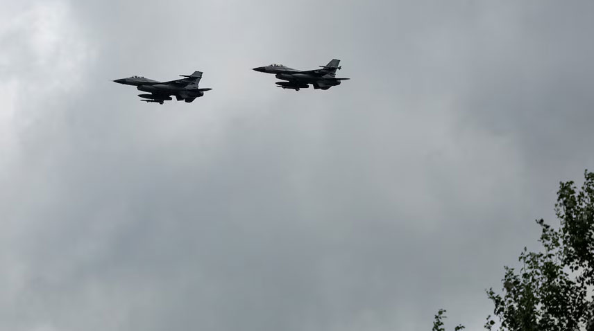 Ukrainian F-16 fighting aircrafts are seen in the air during marking the Day of the Ukrainian Air Forces, amid Russia’s attack on Ukraine