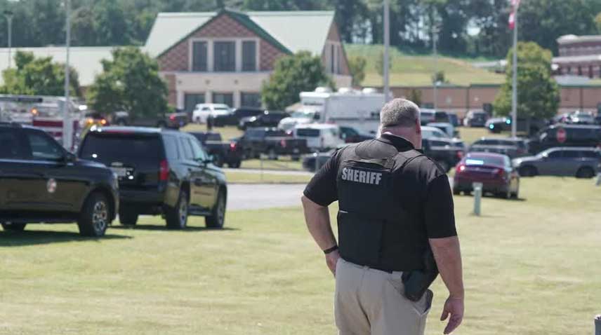 A security official inspecting the shooting site.