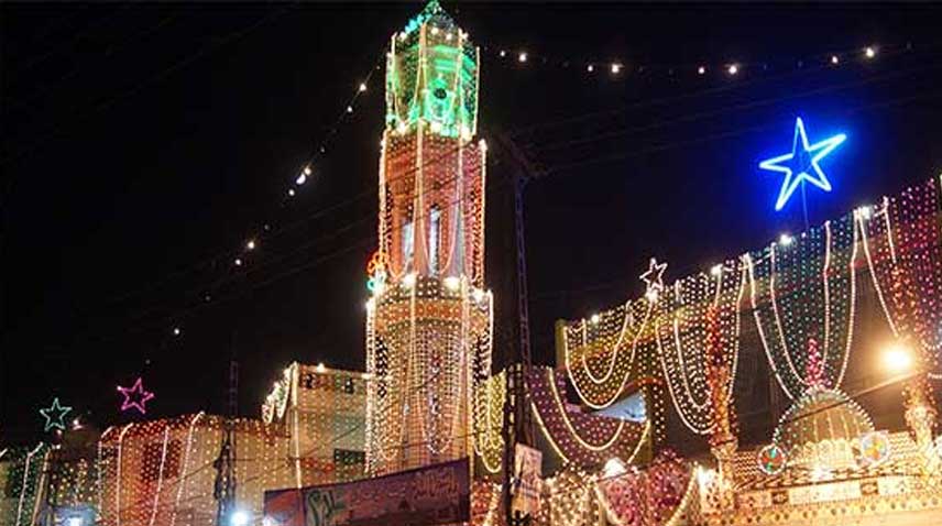 A Masjid is illuminated with lights.