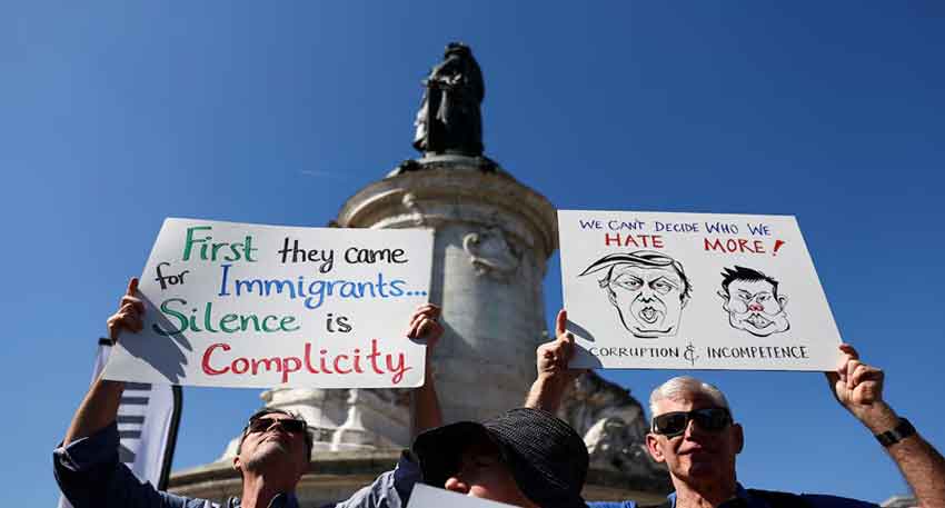 Hundreds of protesters turn out in European cities against Trump People hold placards on the demonstration against US President Trump and his adviser Elon Musk