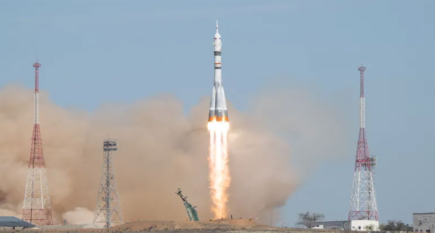 Crew from Russia and US blasts off in Soyuz rocket bound for ISS