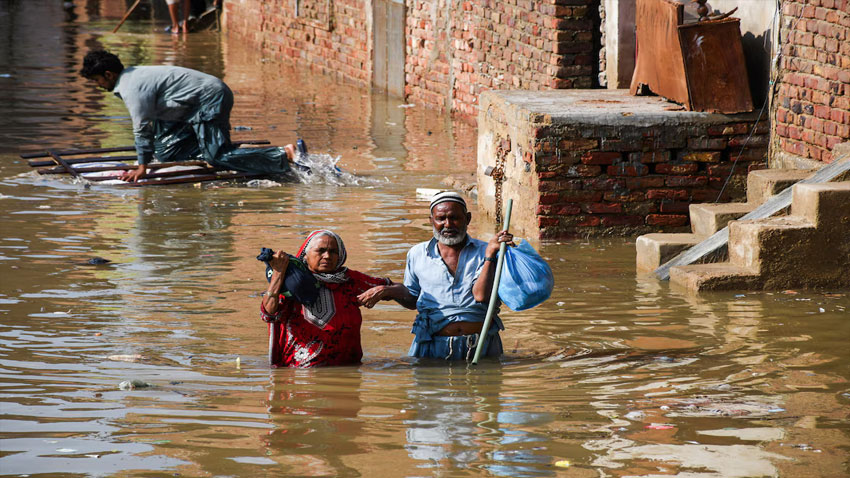 Pakistan lake formed by mountain mudslide threatens ‘catastrophic’ floods People wade through a flooded street after the rain at Latifabad, Hyderabad, Pakistan, August 22, 2025. Reuters