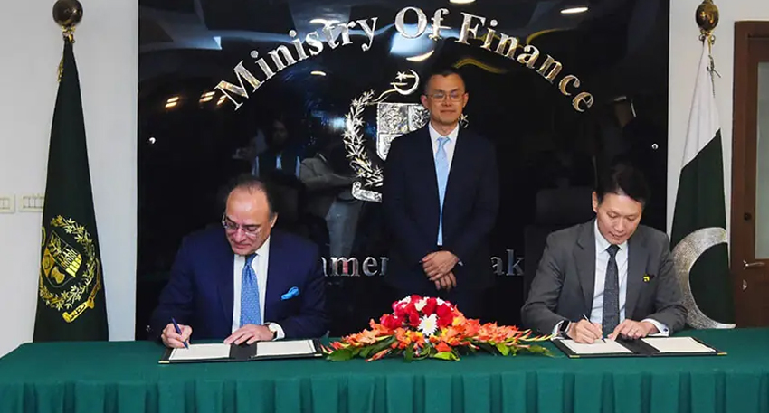 Finance Minister Muhammad Aurangzeb signs a MoU as Binance founder Changpeng Zhao looks on in Islamabad on December 12. — X/@Financegovpk