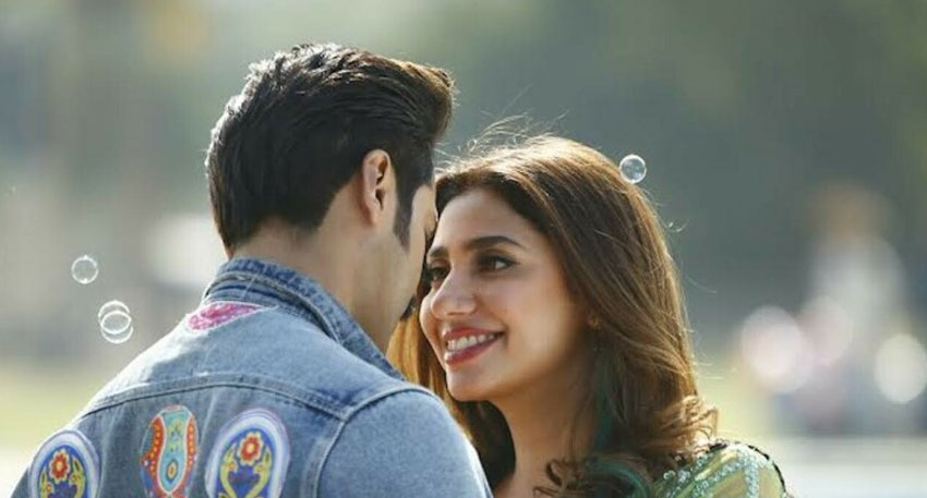 Mahira Khan and Fahad Mustafa smile at each other.