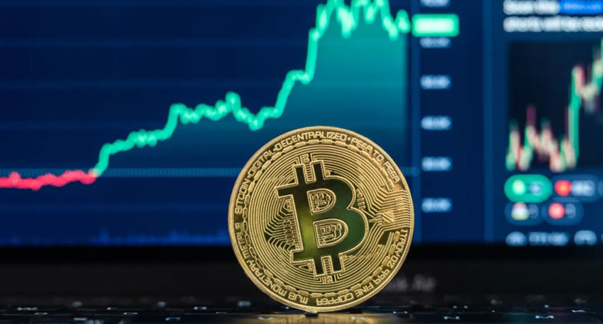 Bitcoin climbs record high amid stock market gains File Photo