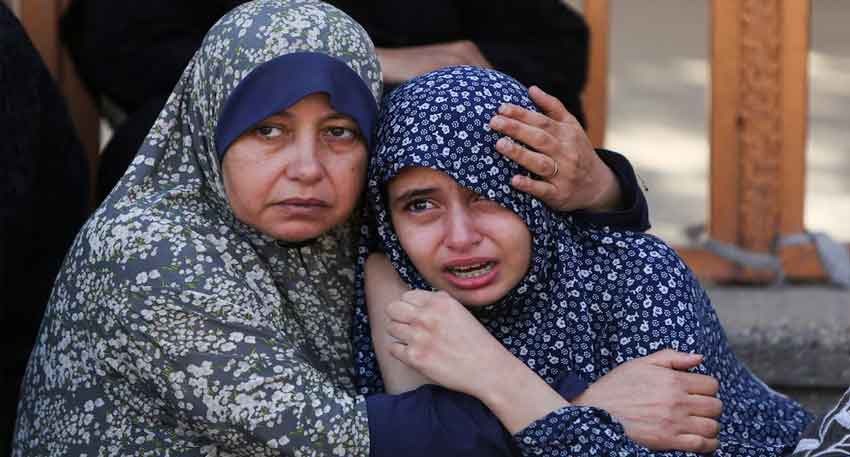 At least 27 Palestinians killed near Gaza aid site, medics say Women react following the death of Palestinians, in what the Gaza health ministry say