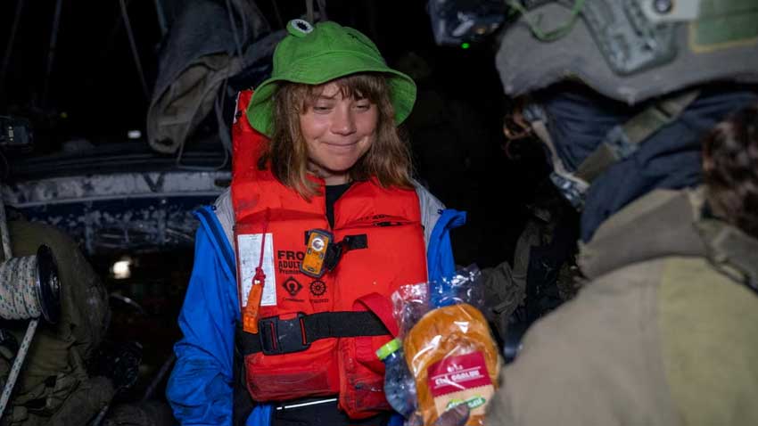 Greta Thunberg deported from Israel after Gaza boat seized An Israeli solider passes a bun to Greta Thunberg onboard the Gaza-bound British-flagged yacht Madleen