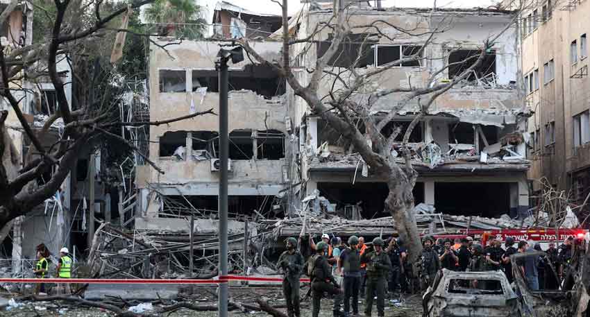 Iran targets Tel Aviv, Haifa in second retaliatory strike Emergency personnel work at an impact site after missiles were launched from Iran to Israel