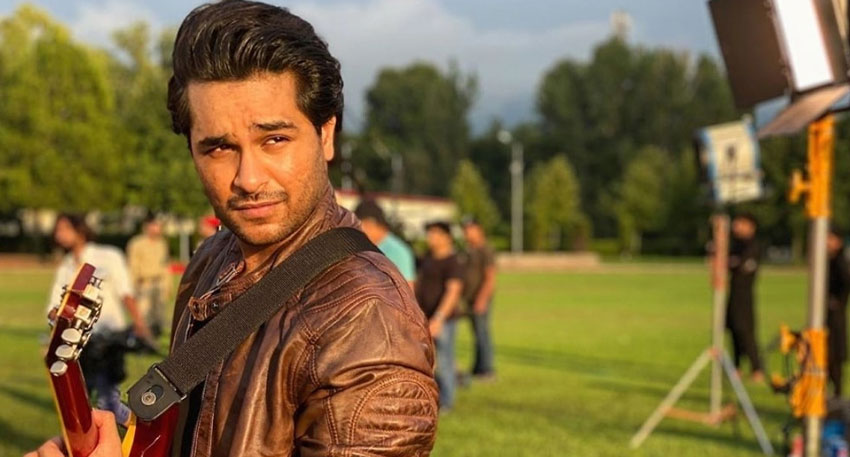 Asim Azhar on an outdoor set