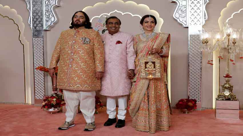 Ambanis suddenly delay their own New York cultural event – Is US-India rift to blame? Groom Anant Ambani poses for pictures with Nita Ambani and Mukesh Ambani on the red carpet on the day of his wedding with Radhika Merchant in Mumbai, India, July 12, 2024. Reuters