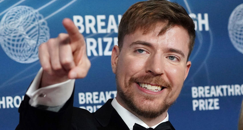 MrBeast at an event smiling at camera.