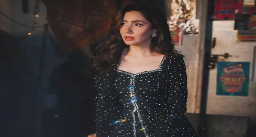 Mahira Khan in a black embellished outfit looking away.