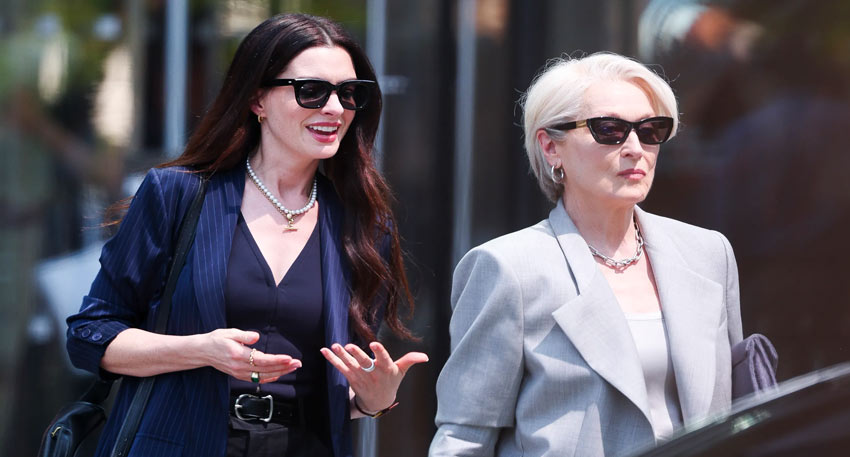 Meryl Streep and Anne Hathaway on a city street in business chic attire for The Devil Wears Prada 2.