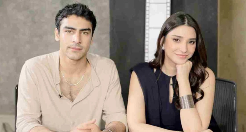 Pakistani actors Khushhal Khan and Ramsha Khan sitting together during a media interview.