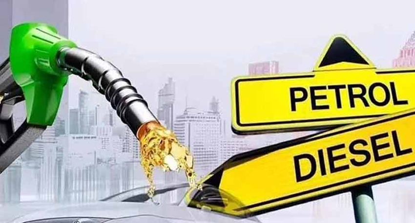 Green fuel nozzle dispensing fuel next to yellow Petrol and Diesel directional signs.