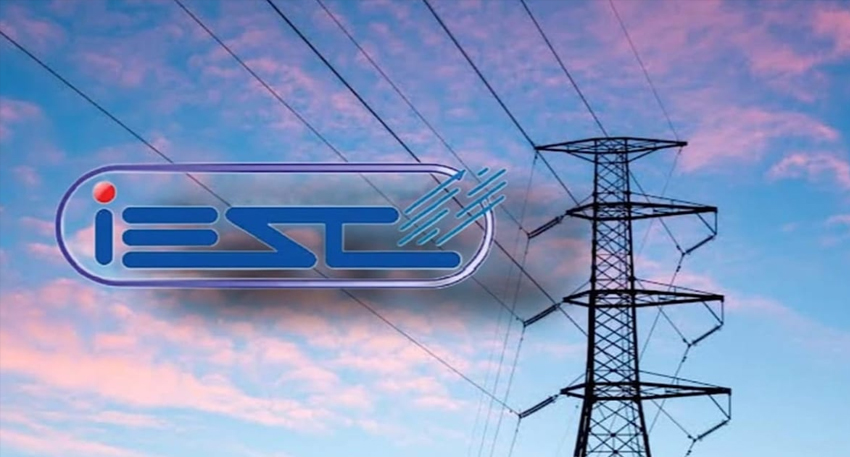 IESCO logo next to an electricity pylon under a cloudy sky.
