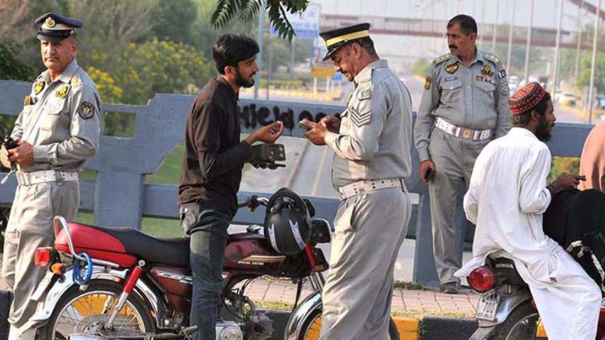 Motorcyclists riding without side-view mirrors or working indicators face fines in Punjab. File photo