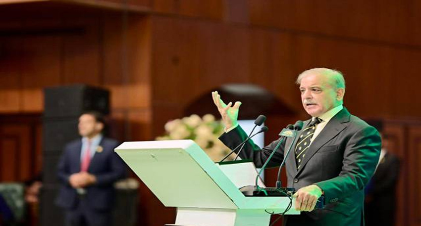 Shehbaz Sharif speaking at a podium.
