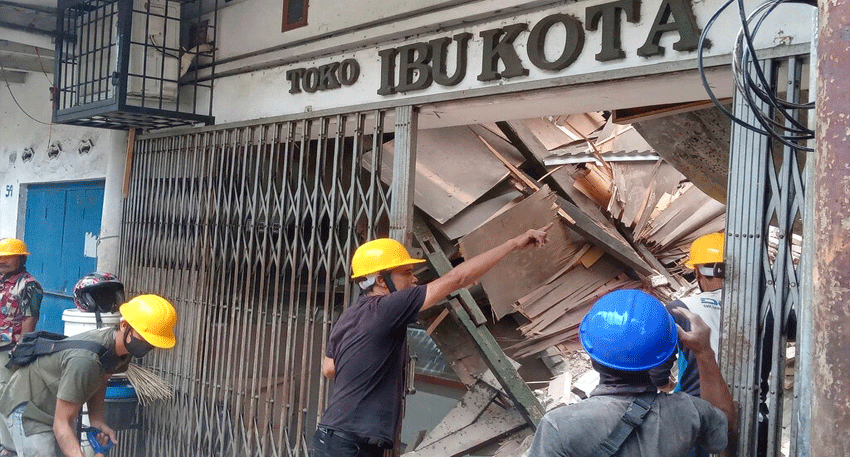 Rescue workers search rubble after a powerful 7.7-magnitude earthquake struck Flores, Indonesia.
