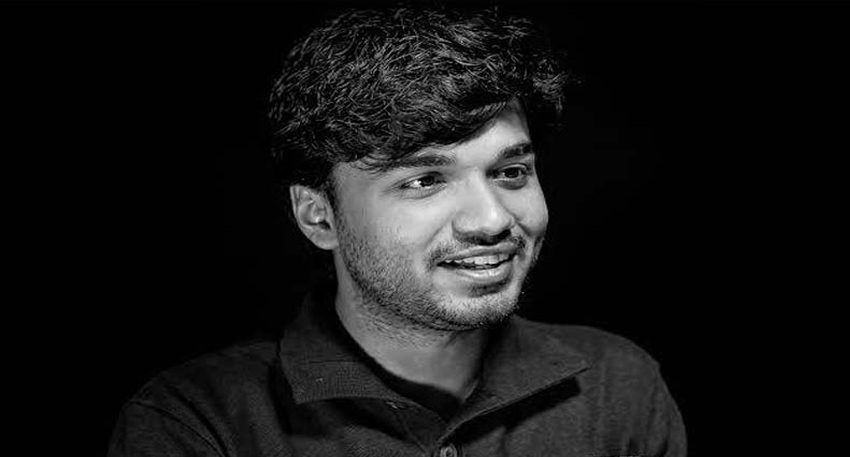 Black and white portrait photo of late entrepreneur Mir Raza.