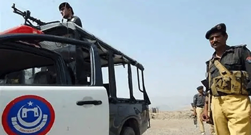 Police personnel investigate the scene after a constable was killed in an attack in Bajaur