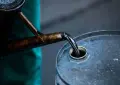 Oil prices slip as investors weigh tougher Iran sanctions