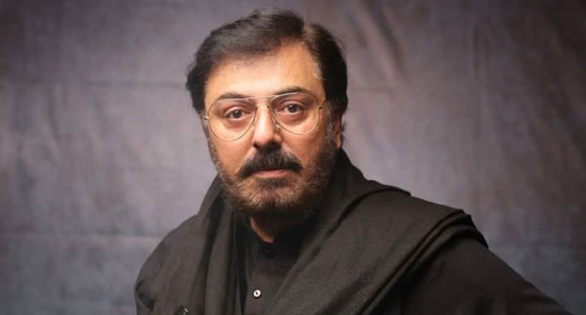 Pakistani actor Nauman Ijaz wearing glasses and a black outfit.