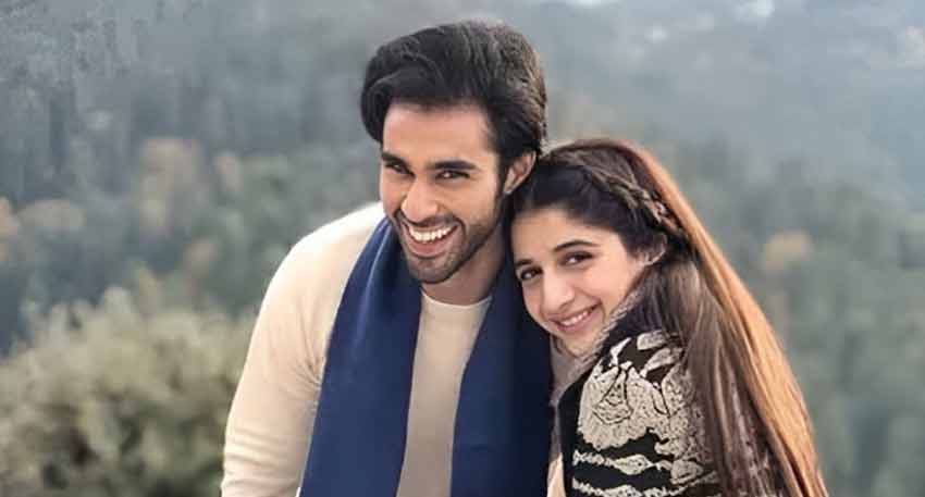 Pakistani actors Mawra Hocane and Ameer Gilani smile together during the filming of their drama serial in Northern areas.