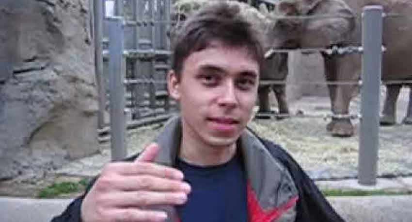 Jawed Karim, YouTube co-founder, stands in front of an elephant enclosure at the San Diego Zoo.