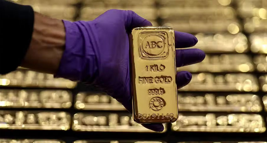 Gold surges as dollar sinks to four year low