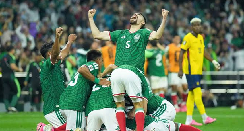Mexico players celebrate reaching the World Cup last 16 with fans.