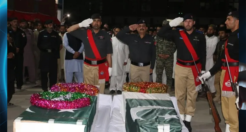 The martyred officials being laid to rest at the Police Lines in Ghalanai