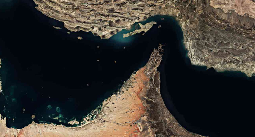 Satellite view of the narrow Strait of Hormuz, showing the Iranian coastline and the Musandam Peninsula.