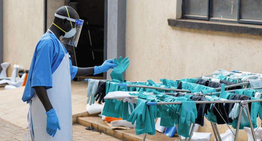 Uganda's Health Minister presents a discharge certificate to the country's last Ebola patient.