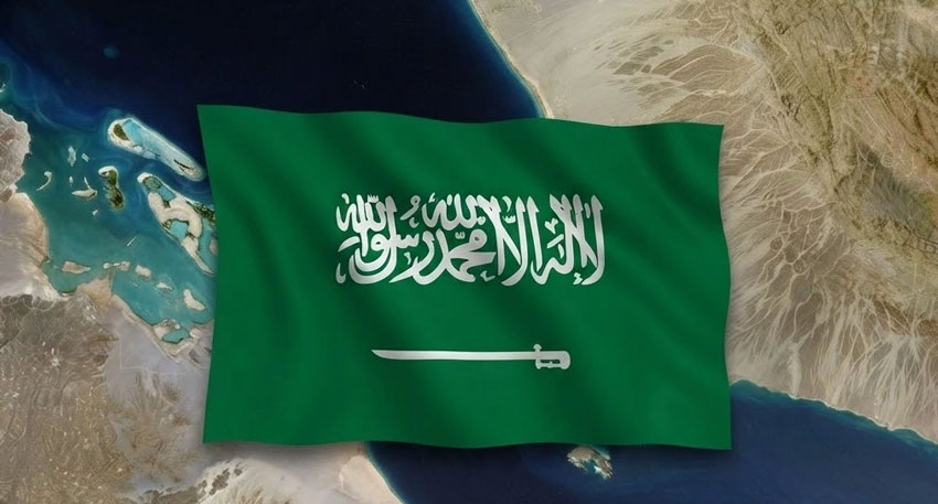 Flag of Saudi Arabia superimposed over a satellite view of the Red Sea and surrounding coastal land.
