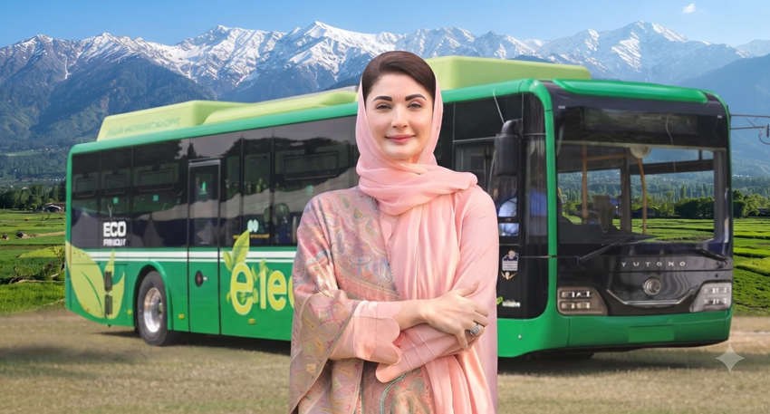 Maryam Nawaz standing in front of a green electric bus with snow-capped mountains in the background.