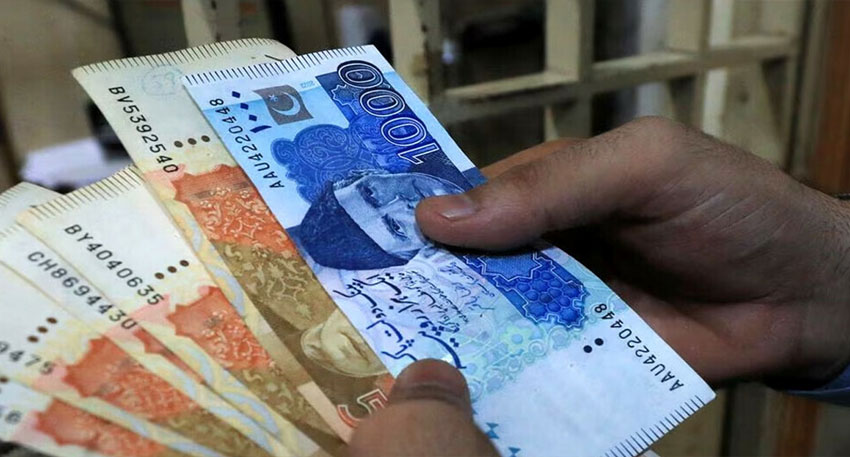 Hands holding various Pakistani rupee banknotes including 1000, 500, and 100 denominations.