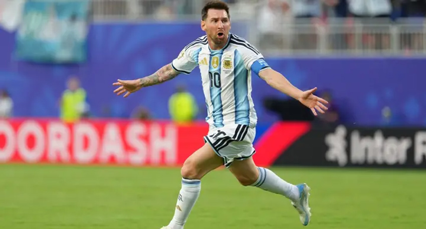 Lionel Messi celebrates scoring his first-ever World Cup hat-trick for Argentina against Algeria in 2026.