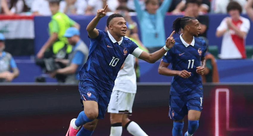 Kylian Mbappé celebrates his first goal against Iraq in France's 3-0 World Cup 2026 win.