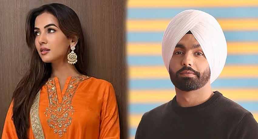 Sonal Chauhan in orange outfit and Ammy Virk in black sweater and white turban.