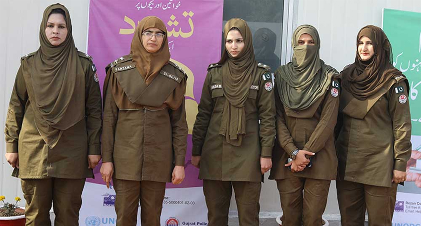 Women Police Squad patrols a busy market in Peshawar to ensure safety and prevent harassment of female shoppers.