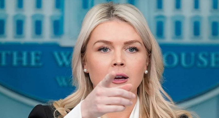 White House Press Secretary Karoline Leavitt points directly toward the camera during a press briefing.
