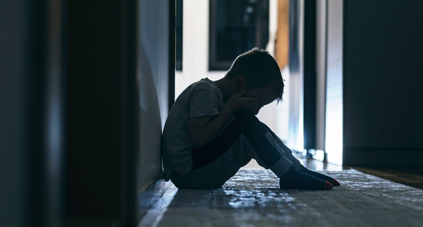 Police take a suspect into custody over the alleged sexual assault of a boy in Kot Lakhpat.