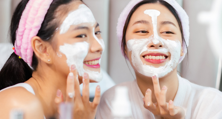 Young consumers exploring Korean skincare products in a beauty store, reflecting the global rise of K-beauty among Gen Z.