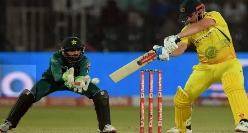 Pakistan wicketkeeper attempts a stumping as an Australian batsman plays a shot during an ODI cricket match.