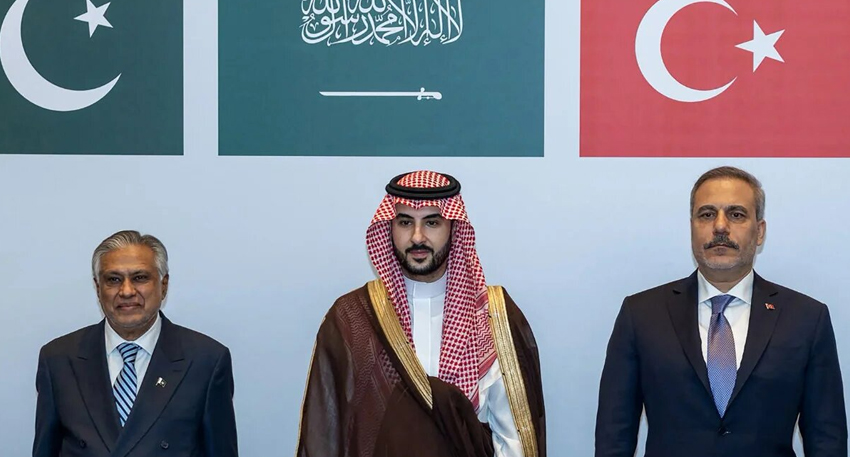 Ishaq Dar, Prince Khalid bin Salman, and Hakan Fidan stand before Pakistan, Saudi, and Turkish flags.