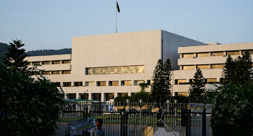 Parliament House building in Islamabad under a clear sky.