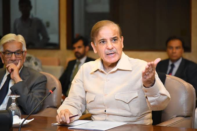 PM Shehbaz Sharif speaking at a meeting with Khawaja Asif.