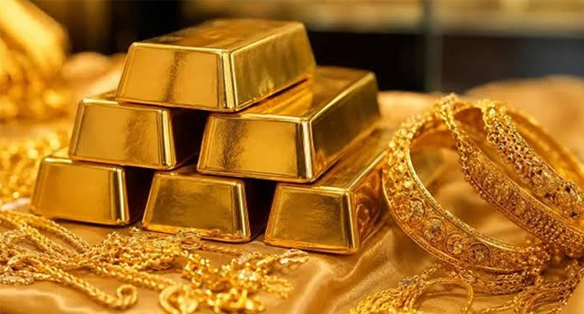 Gold jewellery and biscuits placed in a plate.